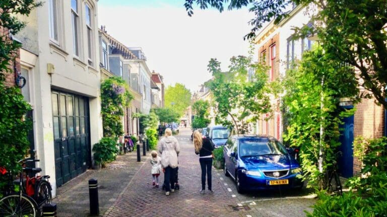 Woonerf street, family walking in the middle street